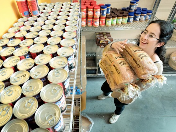 Student stocking a pantry