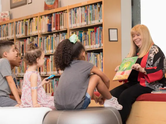 Kathy Short reading to children