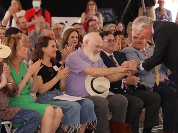 Weil and Robbins shaking hands