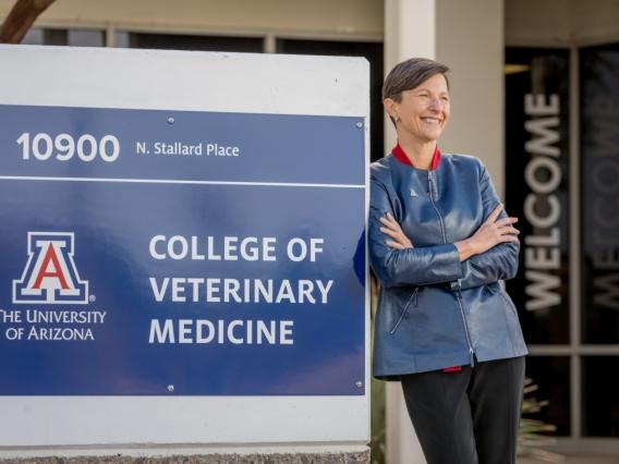 Julie Funk in front of veterinary medicine sign