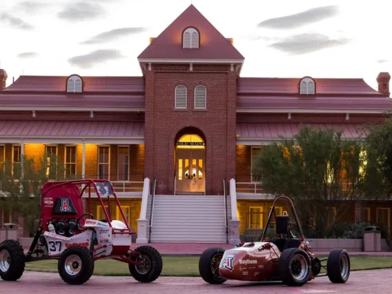 vehicles in front of old main