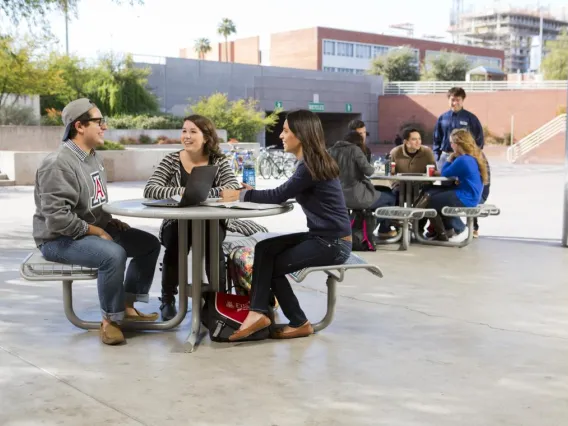 students sitting outside