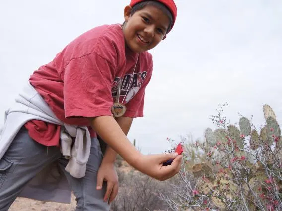 a kid with a plant