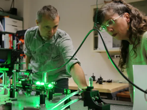 people working with lasers