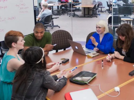 people discussing at a conference table