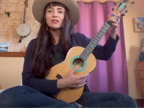 woman playing guitar