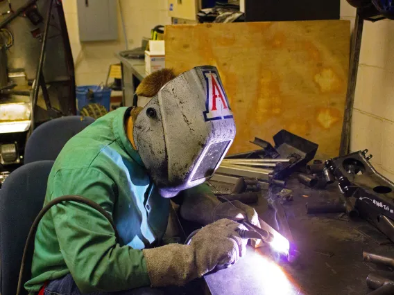 A photograph of an engineering student working