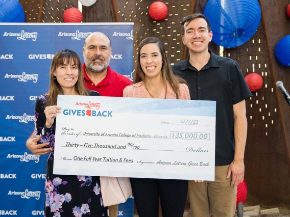 A photograph of first-generation college student, Amaris Tapia winning a $35,000 scholarship from Arizona Lottery
