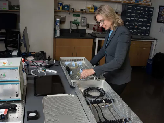 A photograph of a woman in a lab