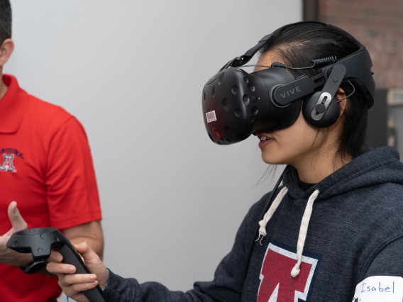 A photograph of a student using a VR headset