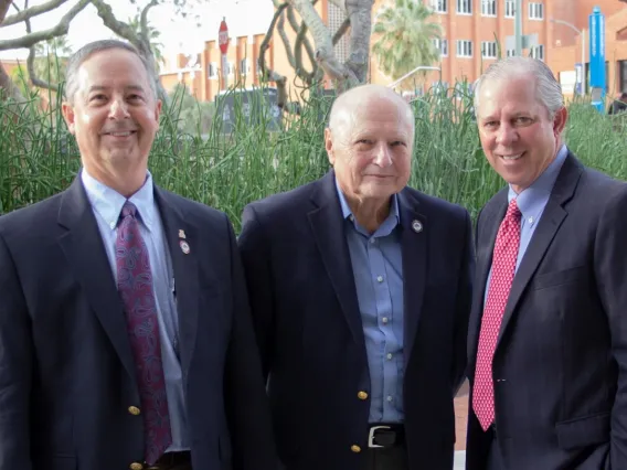 From left: James C. Wyant College of Optical Sciences Dean Thomas Koch, Professor Emeritus James C. Wyant, and university President Robert C. Robbins.