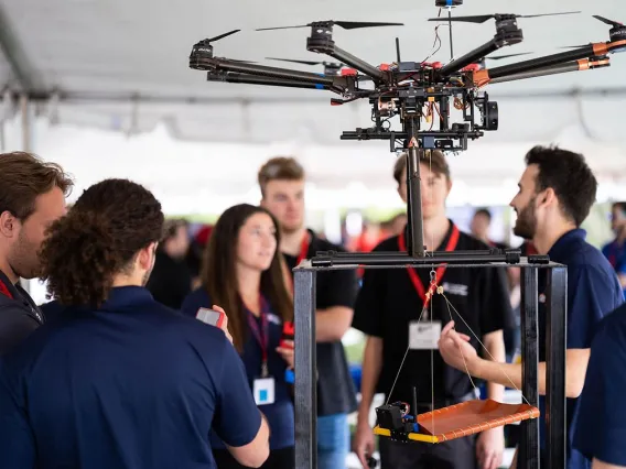 Students engage with drone on UA Mall