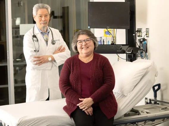 Arthritis Center Director C. Kent Kwoh and Loretta Pedraza in a UAAC patient exam room