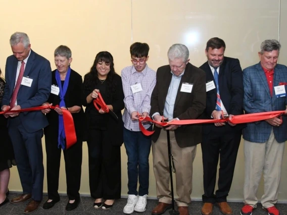 Factulty, staff, students and donors cut ribbon to the new state-of-the-art courtrooms 