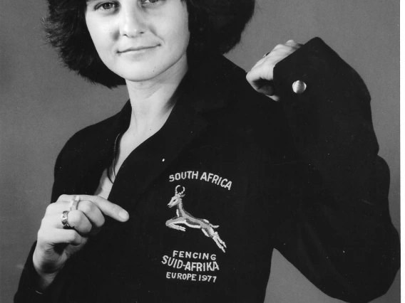 Cathy Kay smiling and showing off her "South Africa Fencing jacket"