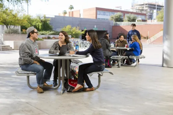 students sitting outside