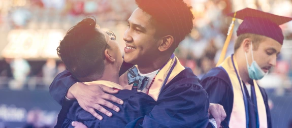 students hugging