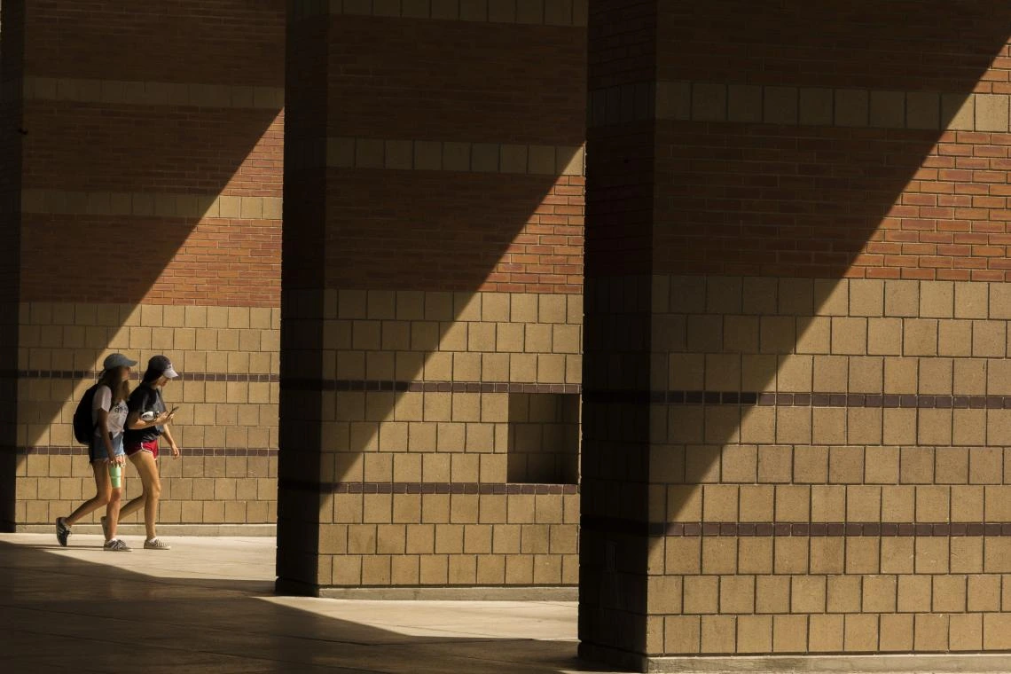 Students walking in some shadows