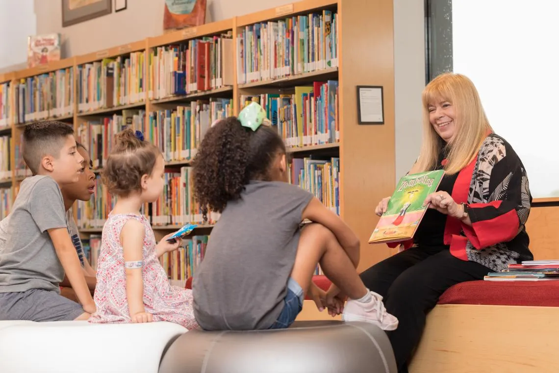 Kathy Short reading to children