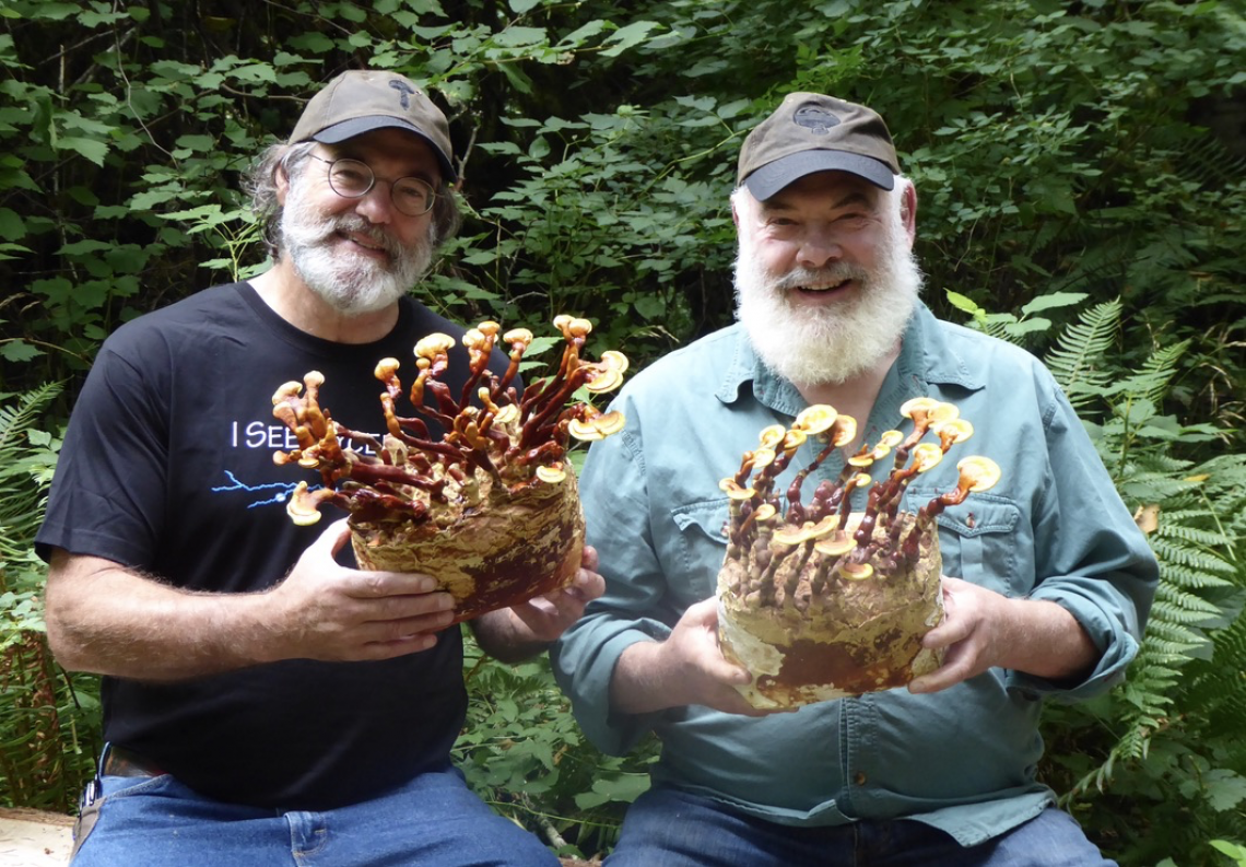 Paul Stamet and Andrew Weil holding some mushrooms