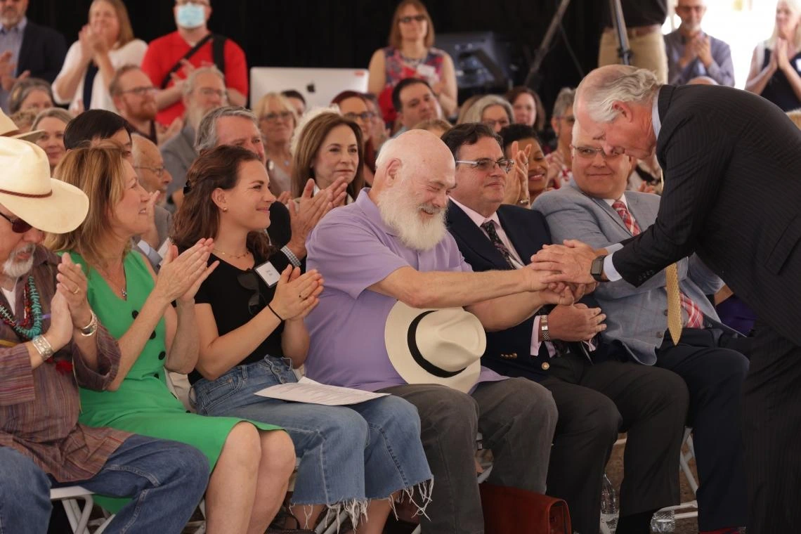 Weil and Robbins shaking hands