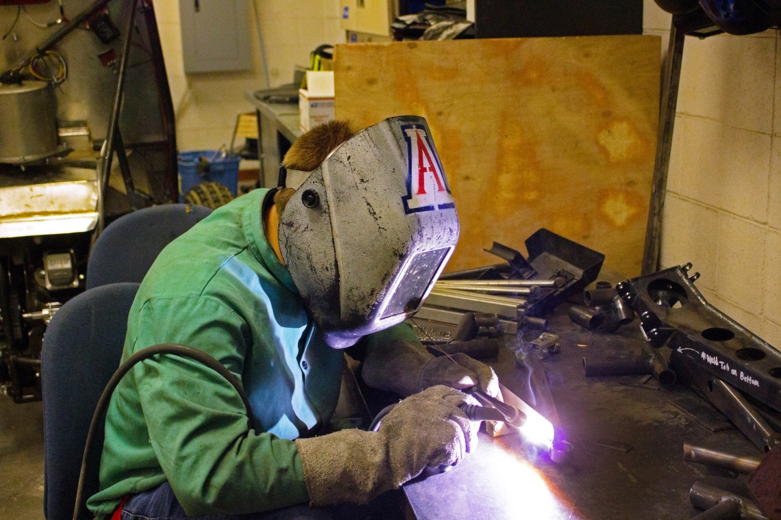 A photograph of an engineering student working