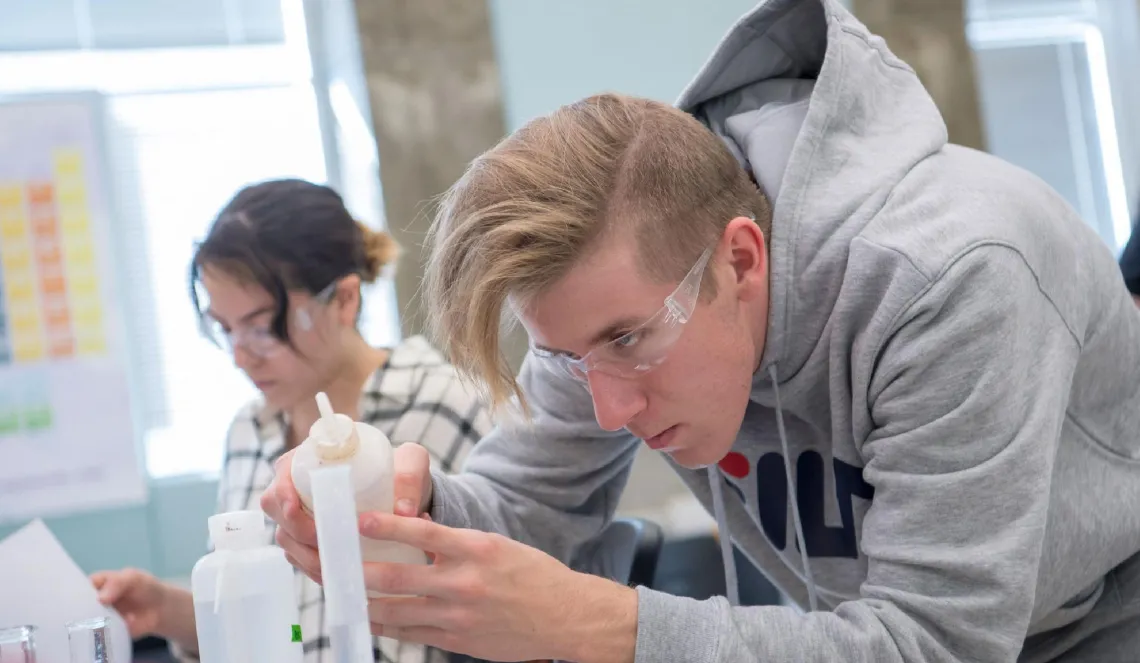 UA student concentrating in a science class