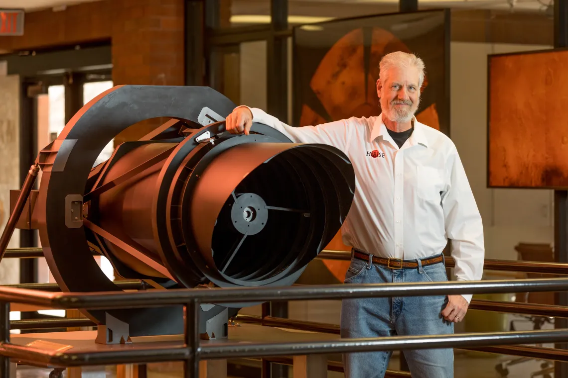 HiRise Faculty Stands near Telescope Equipment