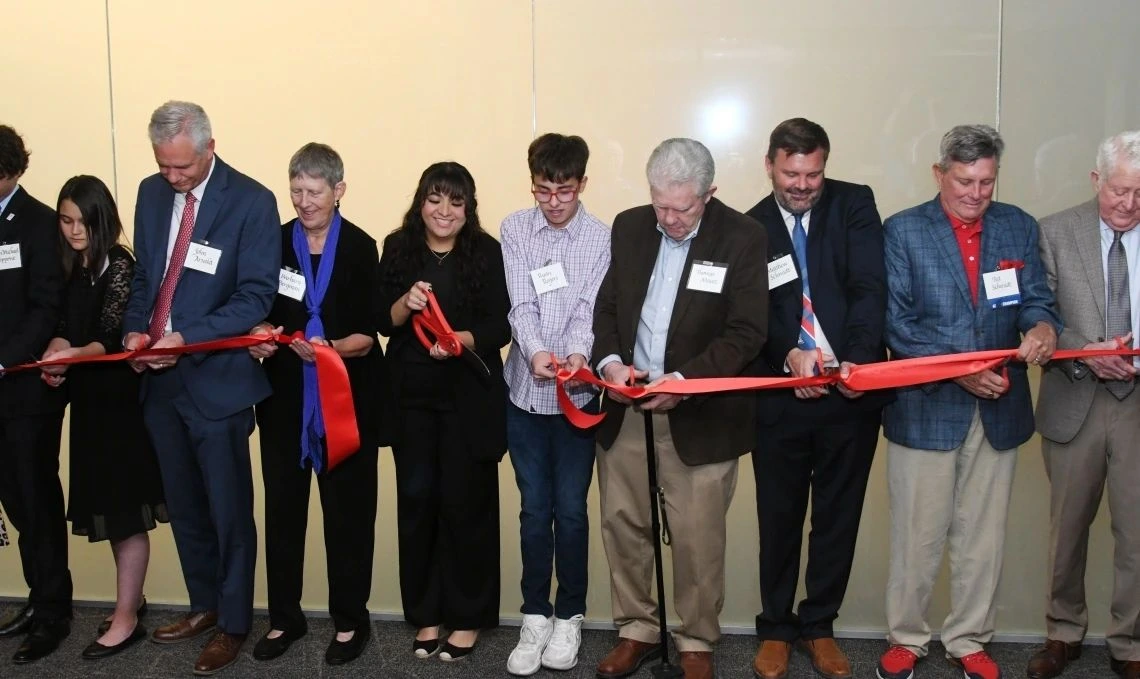 Factulty, staff, students and donors cut ribbon to the new state-of-the-art courtrooms 