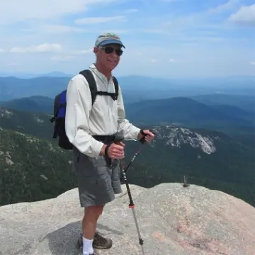 A photograph of George A. Vanderheiden hiking 